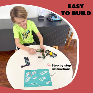 Child building a model with step-by-step instructions on a table. Butterfly EduFields DIY Catapult Shooter Science Kit_available at go science image 4