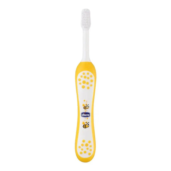 Children's toothbrush with yellow handle and white bristles on a white background. Chicco Toothbrush Yellow 6M-36M go littles product main image