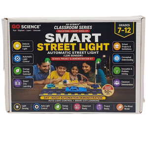 GO Science Smart Street Light Classroom Concept Model Kit in its retail packaging, showing a 7-12 grade educational product box with feature icons and a demonstration photo of children.