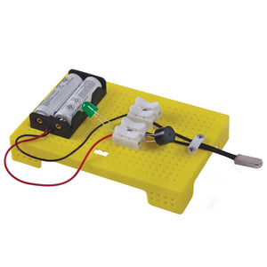 Batteries and electronic components on a yellow breadboard with wires. ITSY BITSY DIY STEM Learning Kit Build Your Own Fire Alarm_Go_Science_product_image_2