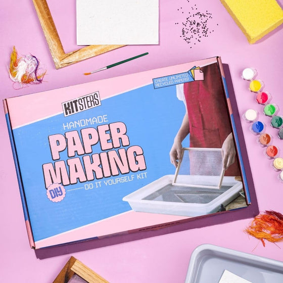 Handmade paper making kit packaging on a pink background with craft supplies. Kitsters DIY Handmade Paper Kit at Go Science Product Image 1