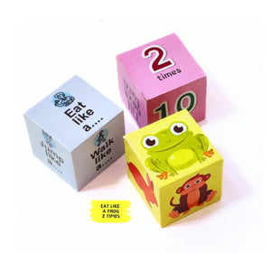 Three colorful children's blocks with different designs and text on a white background. NerdNerdy Sensory Cubes available at go science image 5