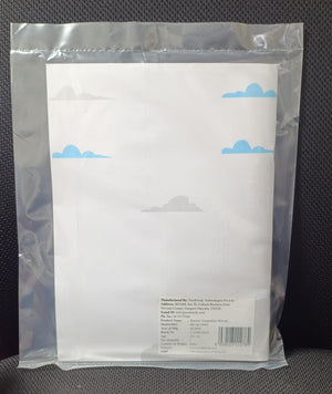 White paper with blue cloud designs in a clear plastic bag on a dark textured surface. NerdNerdy Sensory Integration Manual- Techniques & Application available at go science_image 6