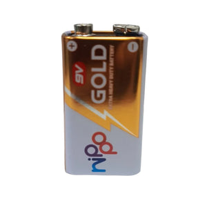 A 9V nippo gold battery with a metallic gold and silver label, featuring the 'nipo' brand logo, standing upright on a white surface against a light gray background.