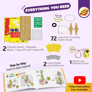 Product packaging with components and manual for a DIY kit, including colored sheets, wooden sheet, PP materials, LED disc, lamp shades, and reflectors.Smartivity Table Lamp available at Go Science Product image