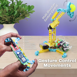 Toy robot arm with gesture control features on a wooden surface with a plant in the background.