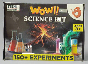 Science kit packaging with volcano and beakers illustration, labeled 'WOW!! Science Kit' and '150+ Experiments'.