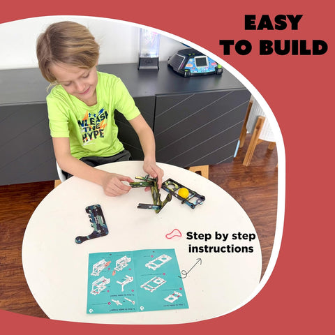 Child building a model with step-by-step instructions on a table.  Butterfly EduFields DIY Catapult Shooter Science Kit_available at go science image 4