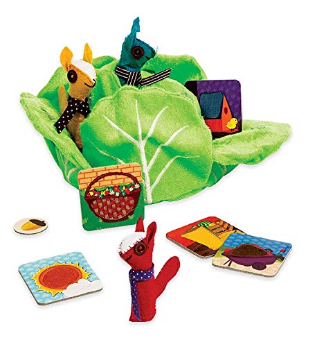 Colorful children's book with plush characters and cards on a white background