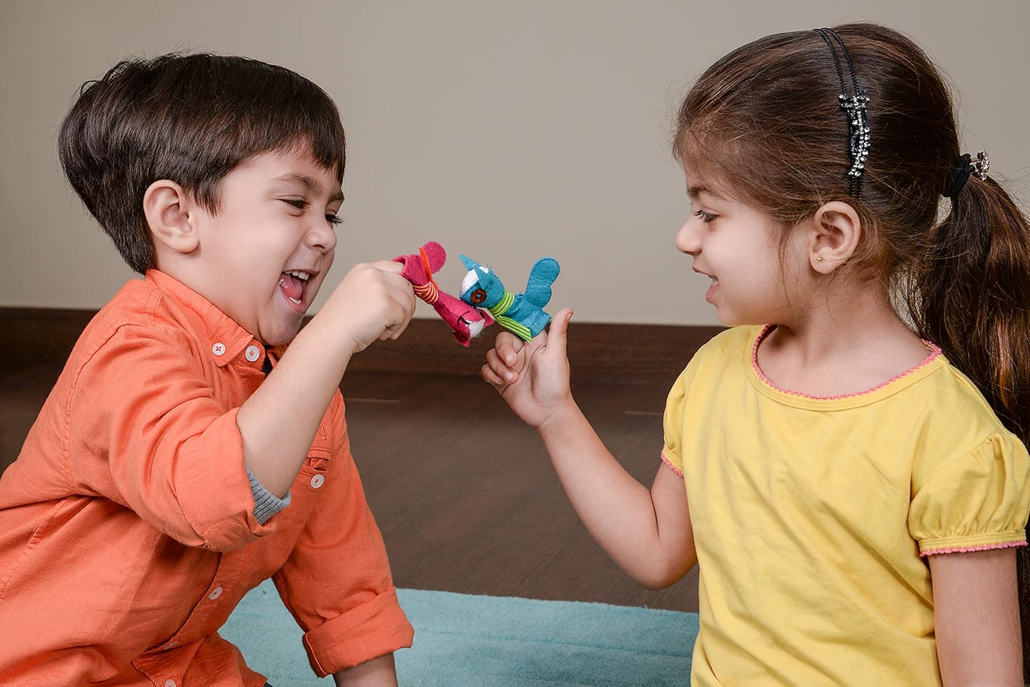 Two children playing with a toy together.