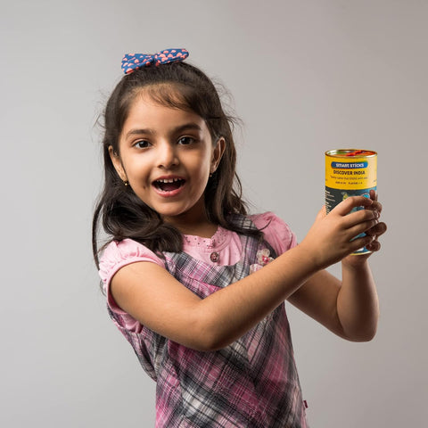 Young girl holding a can with a gray background Chalk and Chuckles Smart Sticks Discover India product image 
