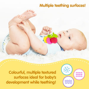 Funskool Giggles Fruit Teether at Go Littles product image 5. Baby playing with a colorful teething toy on a white blanket.