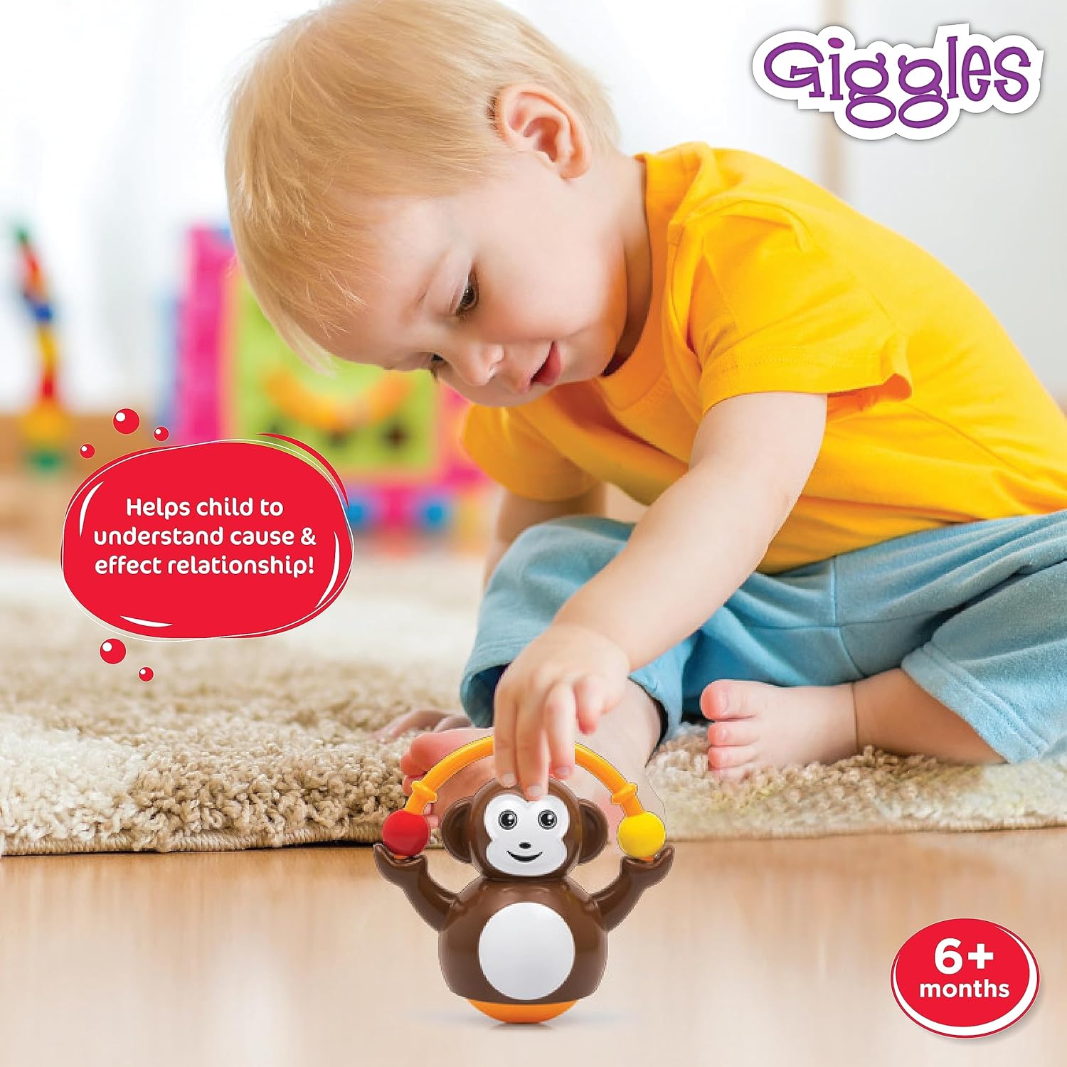 Funskool_Giggles_Push_N_Crawl_Monkey_at_Go_Littles_product_image_3.Child playing with a monkey toy, sitting on the floor with colorful toys in the background, featuring the 'Giggles' brand.
