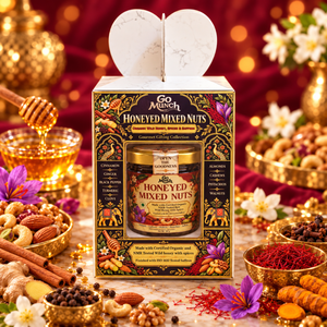 Go Munch Honeyed Mixed Nuts gourmet gift box set, beautifully styled with bowls of almonds, cashews, spices, and honey on a festive red and gold background.