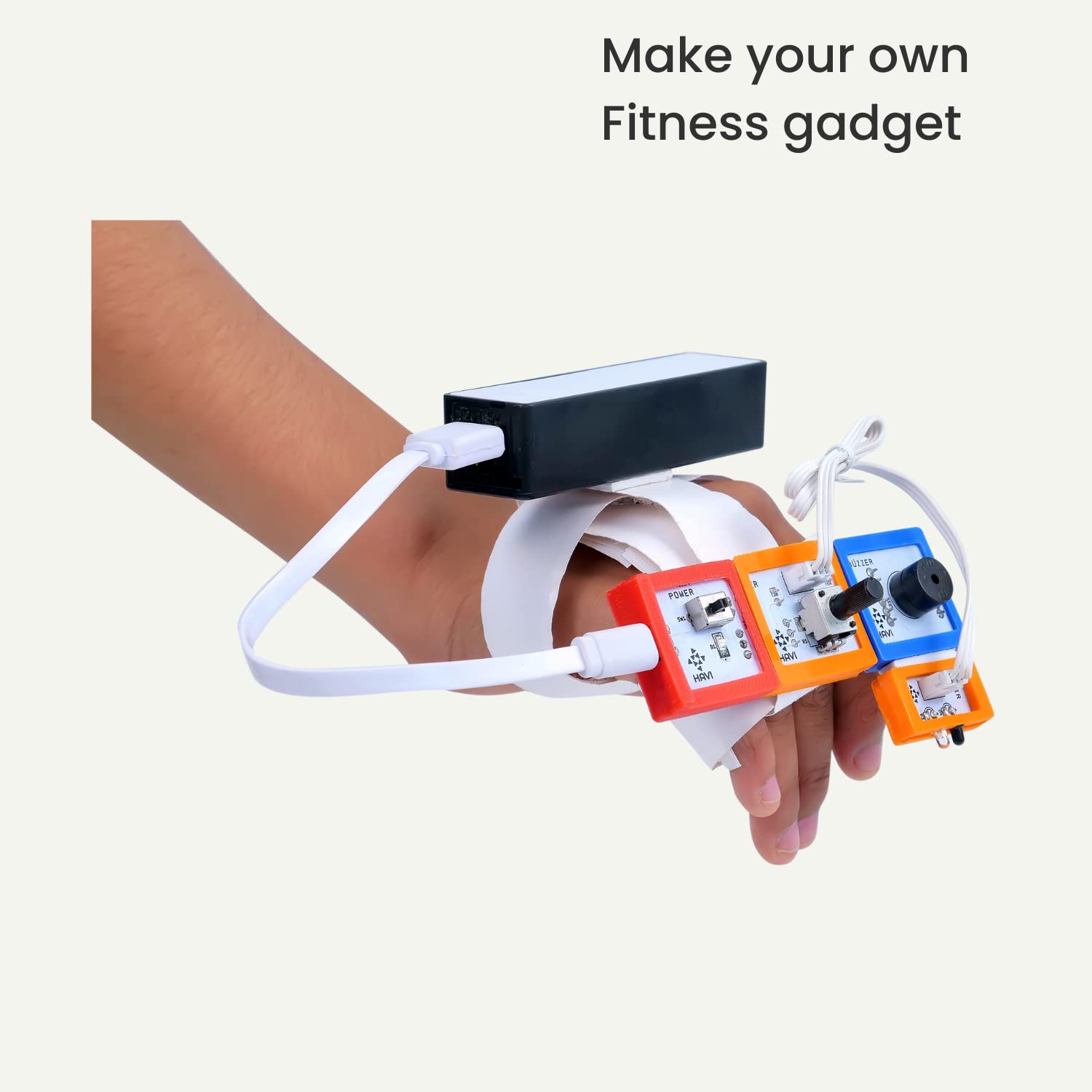 Hand wearing a customizable fitness gadget with colorful components on a white background. Havi 12 in 1 DIY School Sensor Projects kit product image 5 at go science