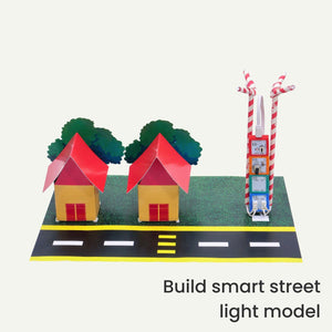 Model street with houses, trees, and a scooter on a white background with LED Street light project. Havi 7 in 1 DIY Smart Light School Projects Kit 7 in 1 STEAM Projects Kit product image 3 at go science