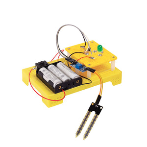 Electrical circuit kit with batteries, wires, and a sensor on a yellow base. Itsy Bitsy Build Your Own Soil Moisture Sensor - STEM Kit - Go Science_product_image 2