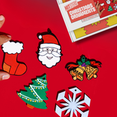 Set of Christmas-themed stickers on a red background. Kitsters DIY Christmas Ornaments Kit available at Go Science product image 1