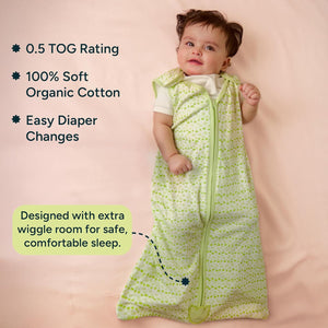 Baby in a green and white patterned organic cotton sleep bag with product features listed. Nintara  Baby Sleep Sack 0.5 TOG Forest Flutter XL Size Go Littles product Image 2