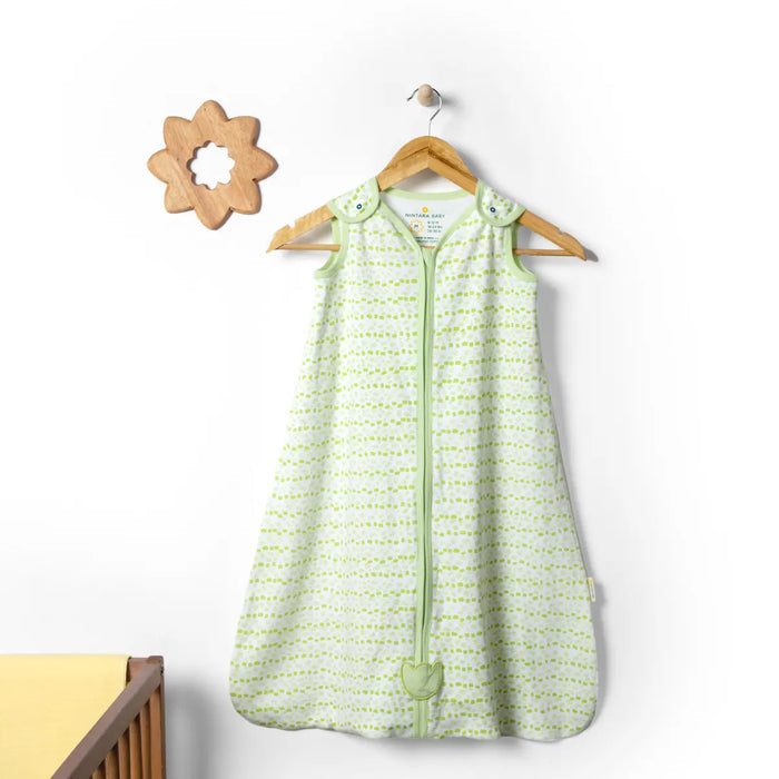 Green baby sleeping bag with white patterns on a wooden hanger against a white background. Nintara  Baby Sleep Sack 0.5 TOG Forest Flutter XL Size Go Littles product Image 8