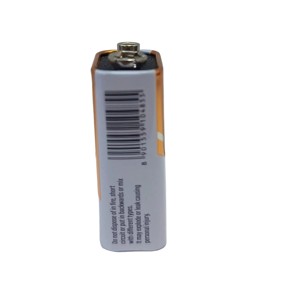 A single 9V nippo battery standing upright on a plain white surface against a white background, showing the side label with a barcode and small text.