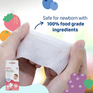 Baby tooth and gum wipes with packaging, held by a hand, on a colorful background. Pigeon Baby Tooth Gum Wipes Strawberry Flavor go littles product image 3