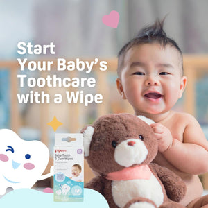 Baby holding a teddy bear with Pigeon baby tooth and gum wipes packaging, text 'Start Your Baby's Toothcare with a Wipe'.