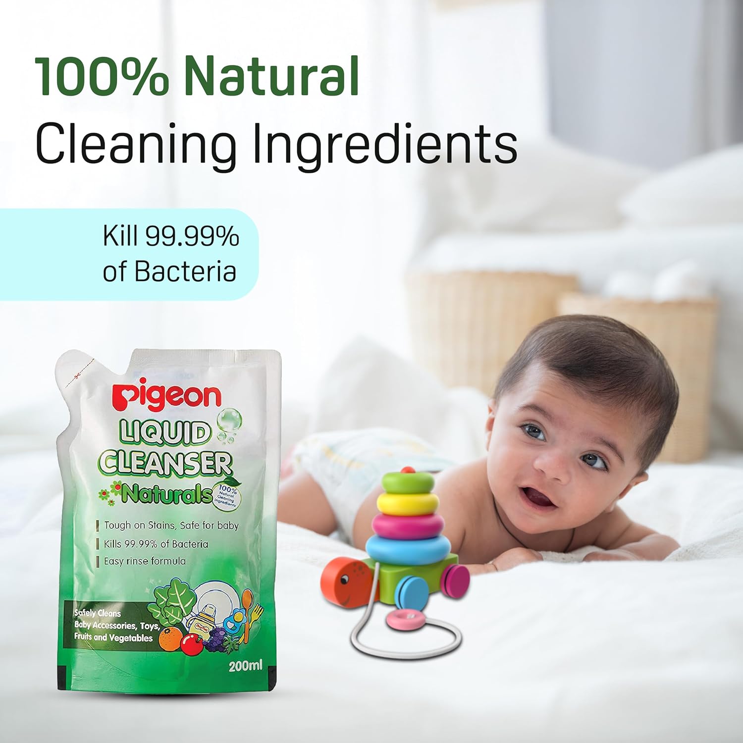 Pigeon liquid cleanser packaging with a baby and colorful toy on a bed. Pigeon Liquid Cleanser 200ml Refill go littles product image 5