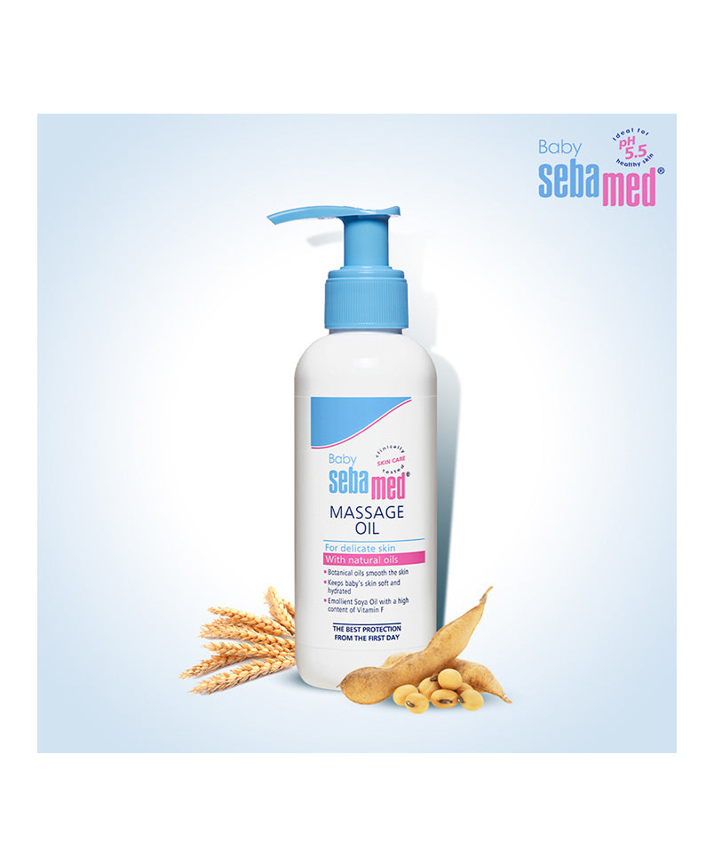 Baby Sebamed massage oil bottle with pump on a light blue background