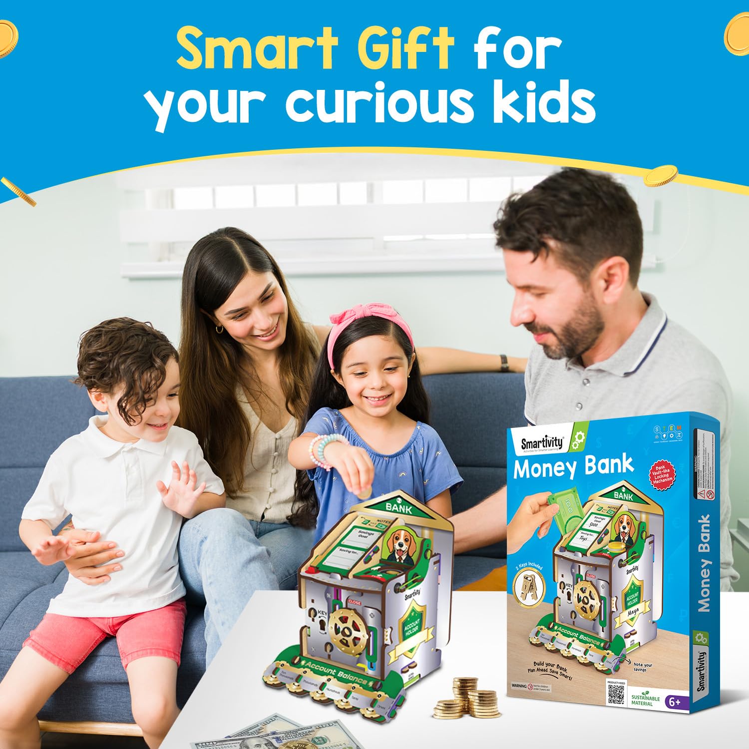 Family playing with a toy money bank and its packaging on a blue couch. Smartivity Money Bank available at Go Science image 8