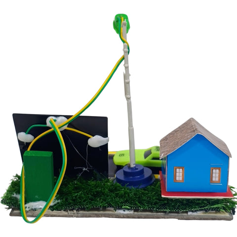 Solar Street Light School project Retail Box back go science classroom series. A miniature model kit featuring a blue house with a brown roof, a green solar panel, a green battery box, and a tall pole with a green cap, all connected by yellow and green wires on a grassy base.