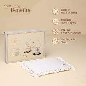 Baby pillow with packaging and benefits listed on a beige background