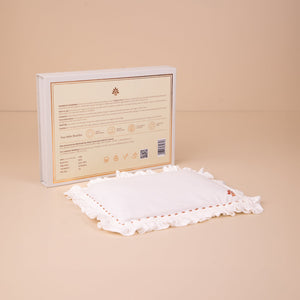 Baby Forest Somya AAKAR NEWBORN pillow White embroidered pillow with a branded box on a beige background