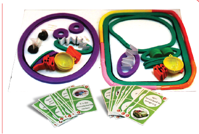Children's educational toy set with colorful rings and cards on a white background