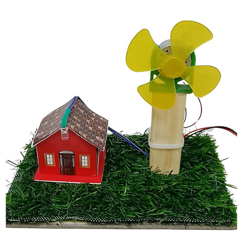 Go Science classroom series A small wind-powered house model on a white background of windmill project. The scene includes a red house with a brown roof, green artificial grass, a wooden post, and a yellow fan attached to a motor with wires.