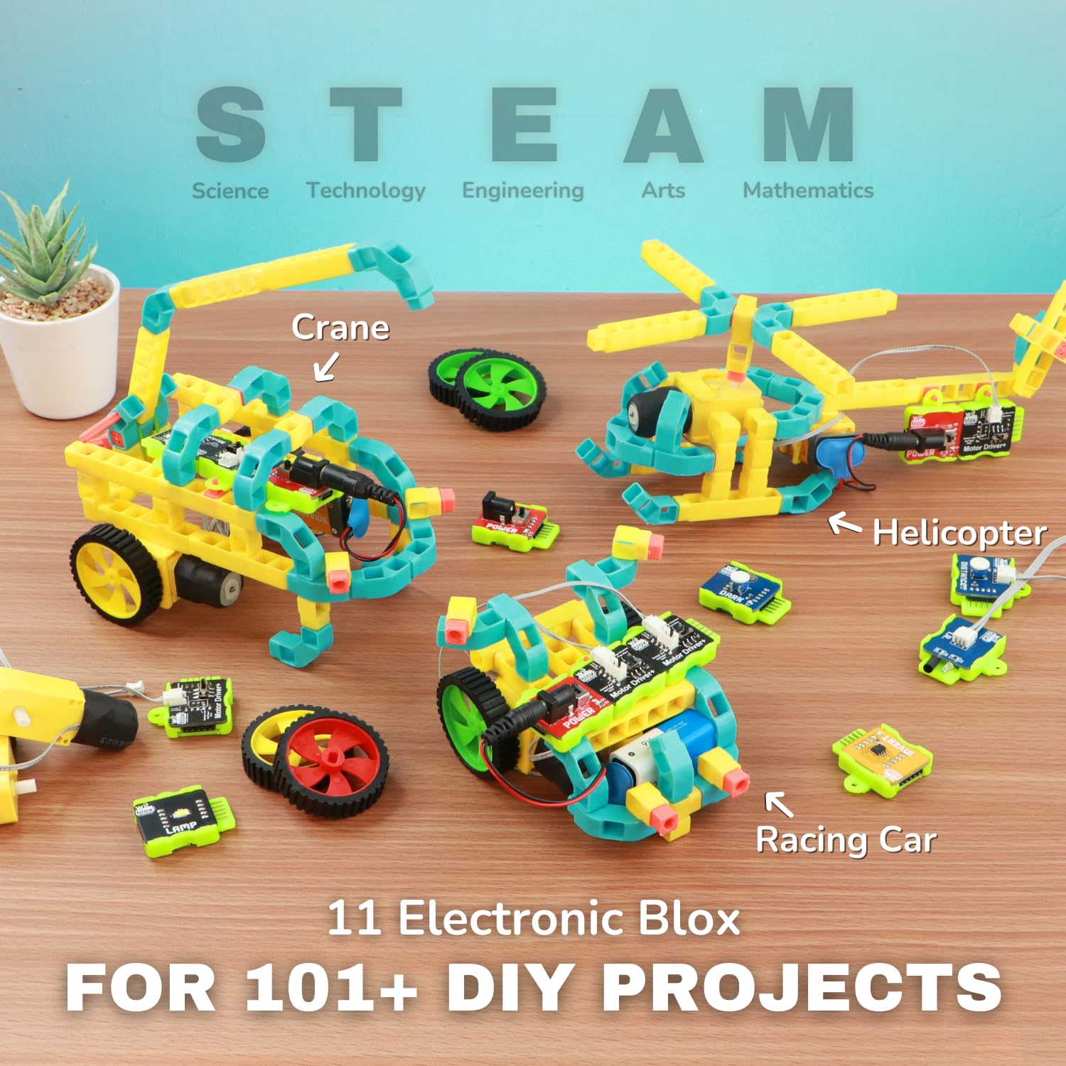 Set of electronic building blocks with labeled components on a wooden surface, featuring 'STEAM' education concepts.